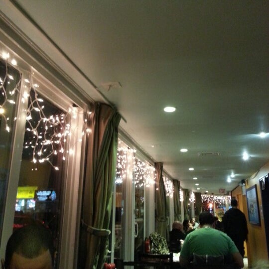 Photo taken at Sabrosura Restaurant by Cigar C. on 2/1/2013