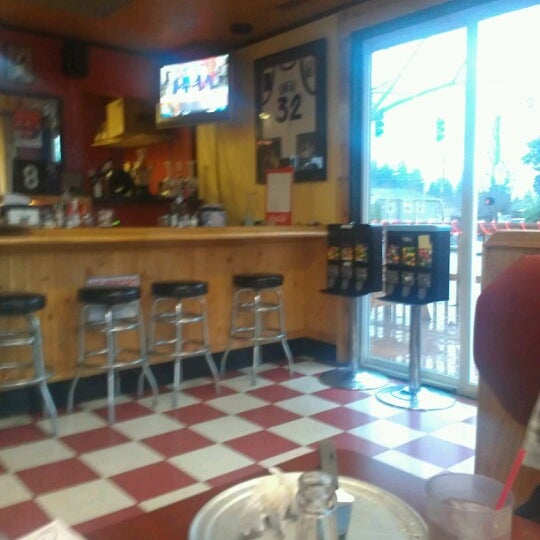 Photo taken at Rudy&#39;s Gourmet Pizza by Christopher W. on 12/23/2012