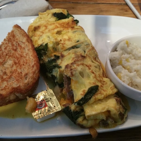 Three Eggs Omelet with cheese, sausage, peppers and spinach.