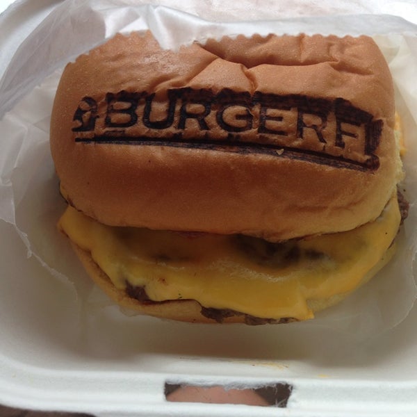 Photo taken at BurgerFi by Sarah M. on 6/25/2014
