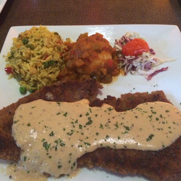 Chicken fried steak with pap & gravy and African rice pilaf
