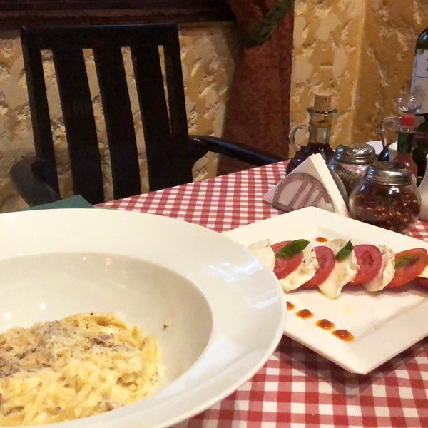 Photo taken at La Vigna Restaurant by Manu A. on 7/31/2018