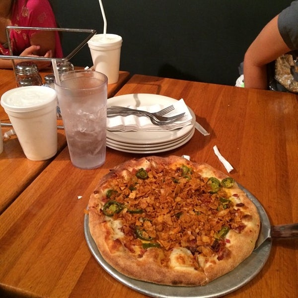 Photo taken at Strong&#39;s Brick Oven Pizzeria by Jeff S. on 6/8/2014
