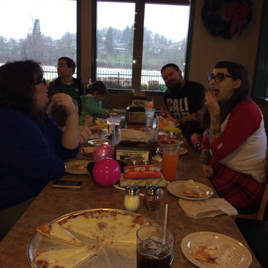 Photo taken at Roaring Rapids Pizza Co. by Miki M. on 12/21/2014