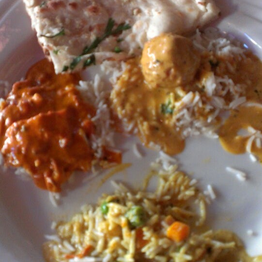 Photo taken at Mughlai Restaurant by Carrie on 5/23/2013
