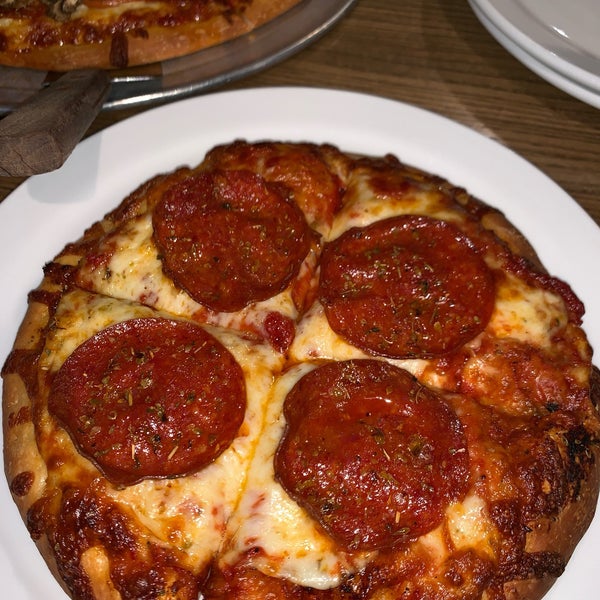 Certified pizza lover graded A+. It  was real cheese & pepperoni (loved the large slices) was delish as well the other ingredients.  The dough had a nice mix of crusty and soft
