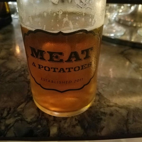 Photo taken at Meat and Potatoes by Luke D. on 7/31/2018
