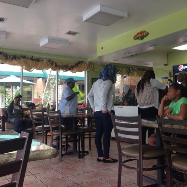 Photo taken at Ackee Bamboo Jamaican Cuisine by M B. on 5/22/2014