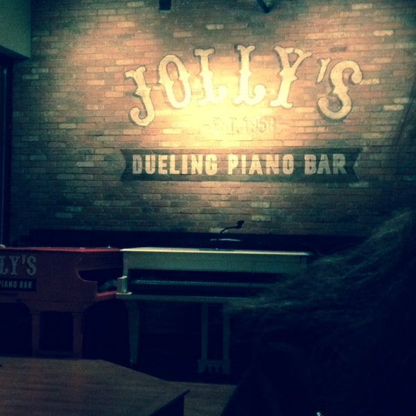 Photo taken at Jolly&#39;s American Beer Bar &amp; Dueling Pianos by Scarlet E. on 10/8/2013