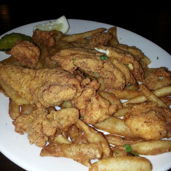 Photo taken at Lucille&#39;s Fresh Catch Kitchen by Caramels&#39; D. on 4/7/2014