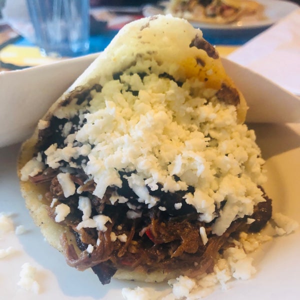 Photo taken at Arepas Cafe by Leslie F. on 3/31/2019