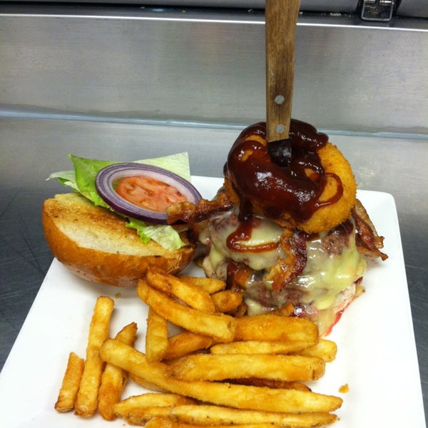 The Epic Burger...two half pound certified angus beef patties stacked with onion rings, bacon, roasted red peppers, BBQ sauce and havarti cheese with lettuce, tomato and mayo! Yum!!
