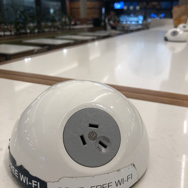 If you’re looking for power outlets to charge your electronics, head to the food court. There are sockets (and USB outlets) on both the shared tables and the individual tables.