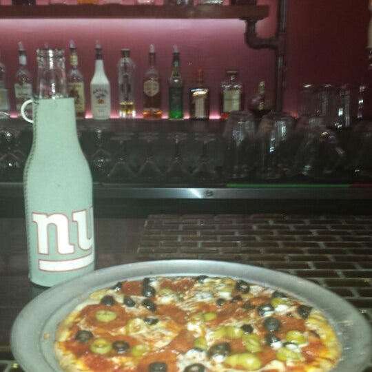 Photo taken at Evil Olive Pizza &amp; Bar by Jacqueline O. on 9/22/2013