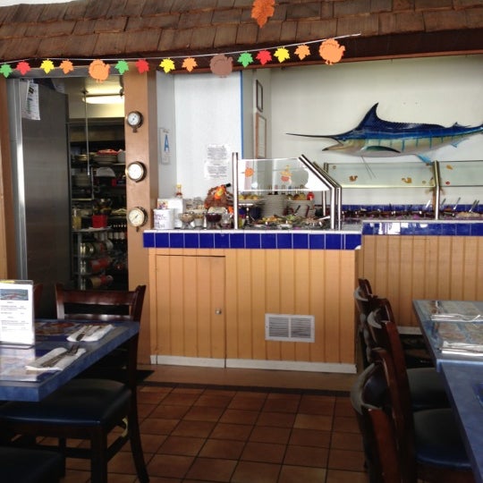 Photo taken at Crusty Crab Fish Market and Restaurant by Ansen G. on 11/4/2012