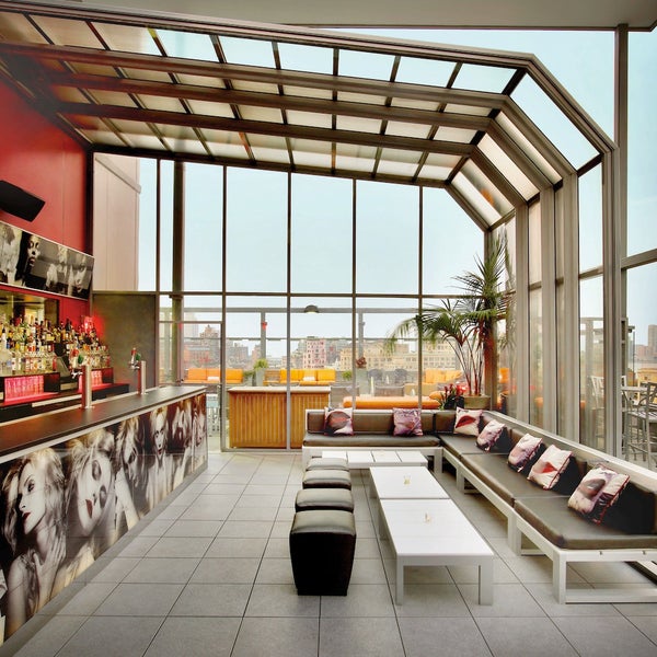 The rooftop pool and bar haven't lost their luster, oh no—edgily dubbed Plunge, the bar is plastered with photos of sensuous ladies while photographs of pursed red lips adorn pillows on the banquette.