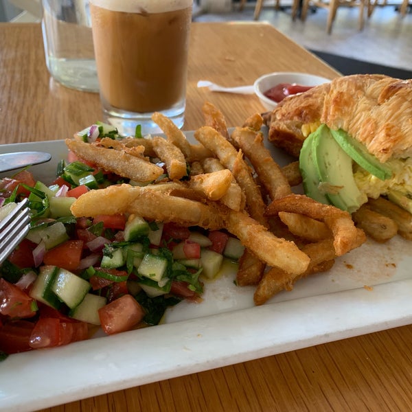 Great croissant egg sandwich and amazing fries and Israeli salad.. tastes like Israel! Great vibe and great coffee too - nice service