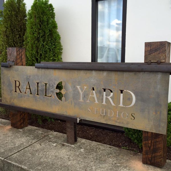 Sign Close up - made from reclaimed railroad steel and hardwood ties.  In front of our new location