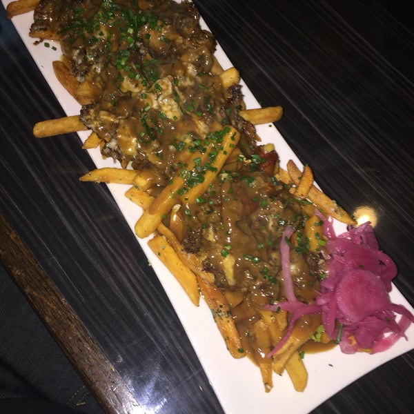 Oxtail poutine for $8 during happy hour. Can't beat that price for the portion and flavor. Plus it's oxtail!