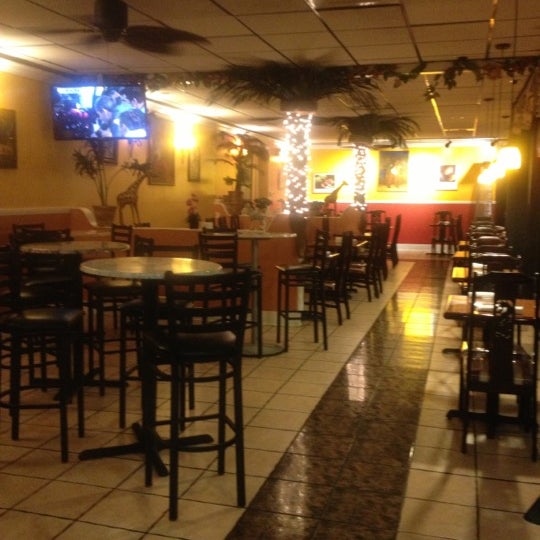 Photo taken at Derrick&#39;s Jamaican Restaurant by Kelly-Ann H. on 10/10/2012