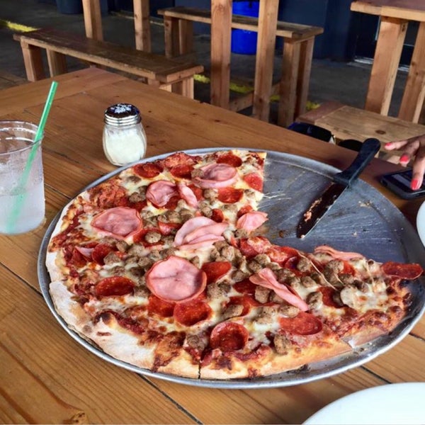 The Woodshed pizza is a meat lovers dream with a fresh tomato sauce!