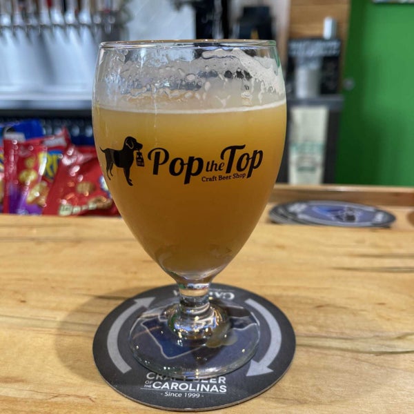 Photo taken at Pop the Top Craft Beer Shop by Dan K. on 8/5/2022