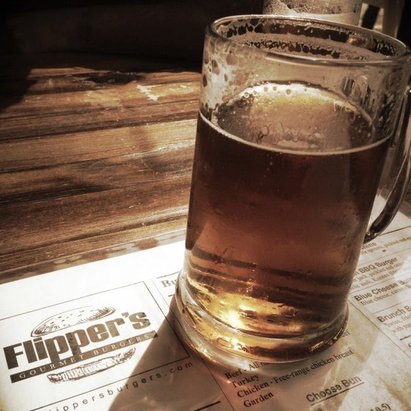 Photo taken at Flipper&#39;s Gourmet Burgers by Erin P. on 4/6/2015