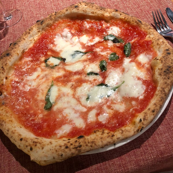 Perfect Margherita pizza, friendly service, and very nice music.