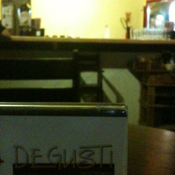 Photo taken at Degusti Bar &amp; Restaurante by Tony P. on 3/7/2013