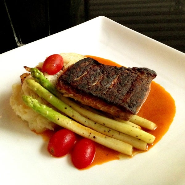 Pan Seared Sea Bass with asparagus, toasted fennel, grilled scallions and a red wine sauce.