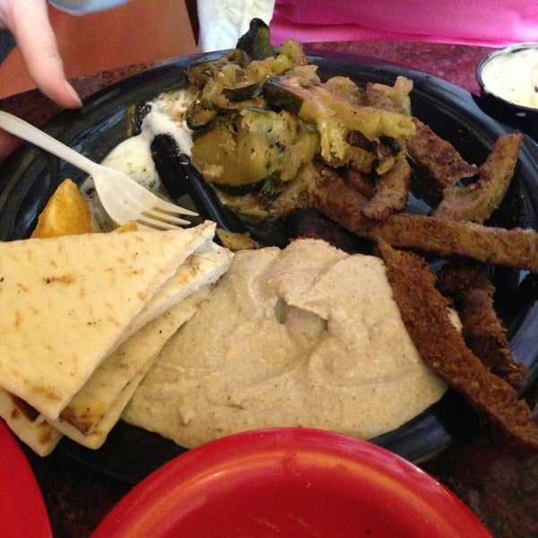Photo taken at Poccadio Moroccan Grill &amp; Sandwiches by John S. on 4/6/2013