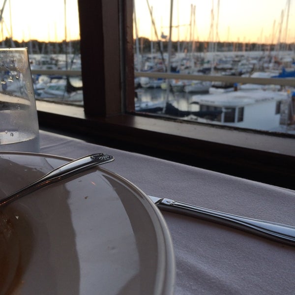 Photo taken at The Marina Restaurant by Andrew G. on 7/30/2014