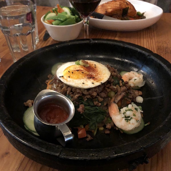 Breakfast lunch dinner. Stone-pot dishes served sizzling @ several hundred degrees . Rice veggies prawns and minced pork with chili sauce and fried egg stirred/mixed table side Not to miss! 10/10 dish