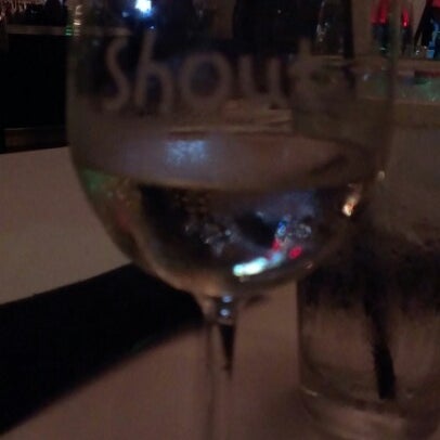 Photo taken at Shout! Restaurant &amp; Lounge by Joaquin A. on 9/16/2012