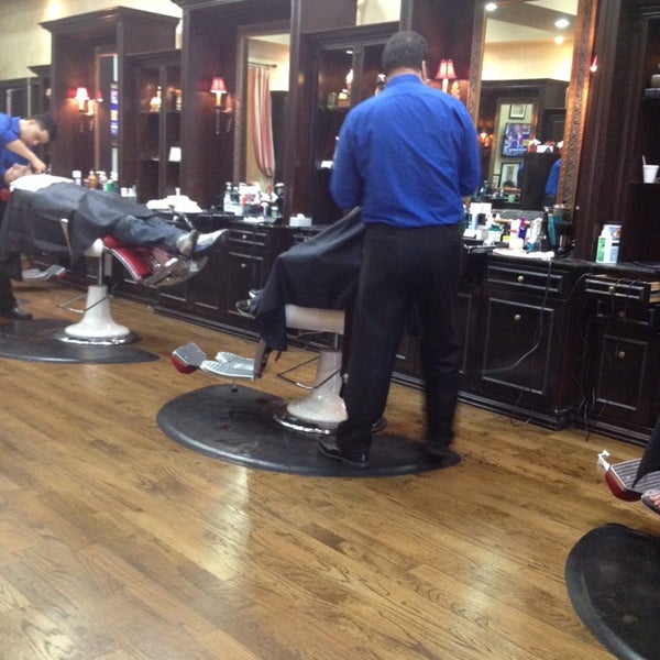 Photo taken at Churchill&#39;s Barber Shop by Trey P. on 12/21/2013