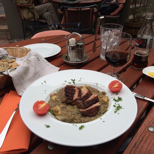 Photo taken at Oliva Restaurant by Szabolcs D. on 11/7/2015