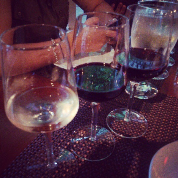 Photo taken at Grand Cru Wine Bar and Cafe by Carolina R. on 6/26/2013