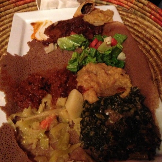 Photo taken at Queen of Sheba Ethiopian Restaurant by Aleks K. on 11/21/2012