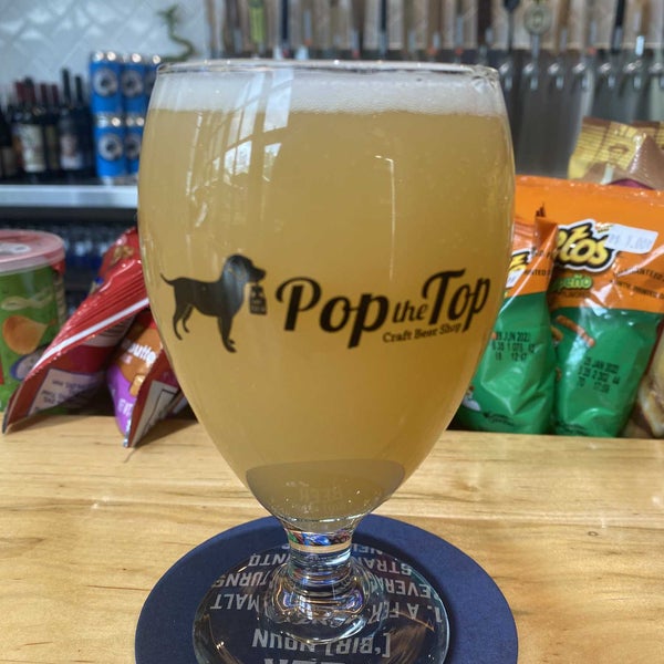 Photo taken at Pop the Top Craft Beer Shop by Christian R. on 5/3/2022