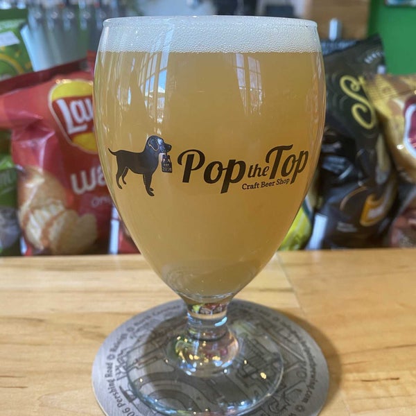 Photo taken at Pop the Top Craft Beer Shop by Christian R. on 3/2/2022