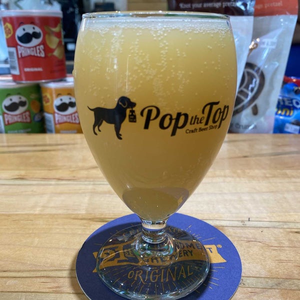 Photo taken at Pop the Top Craft Beer Shop by Christian R. on 5/30/2022