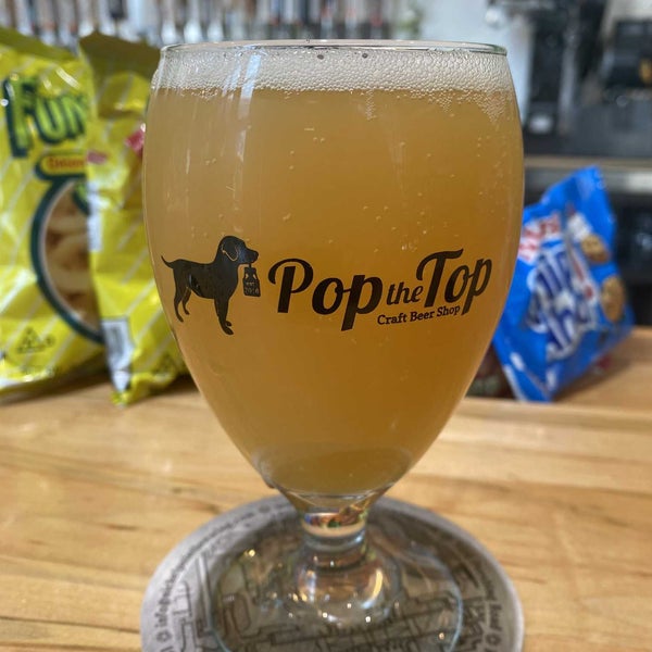 Photo taken at Pop the Top Craft Beer Shop by Christian R. on 3/31/2022