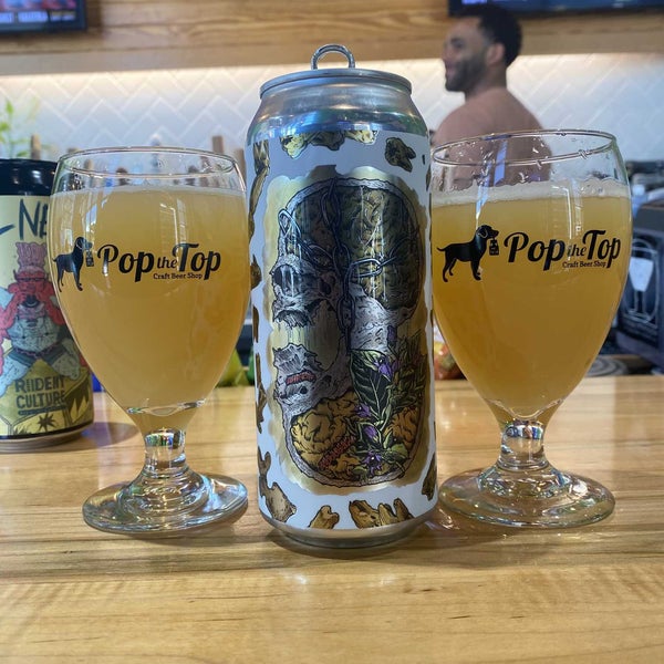 Photo taken at Pop the Top Craft Beer Shop by Christian R. on 3/26/2022