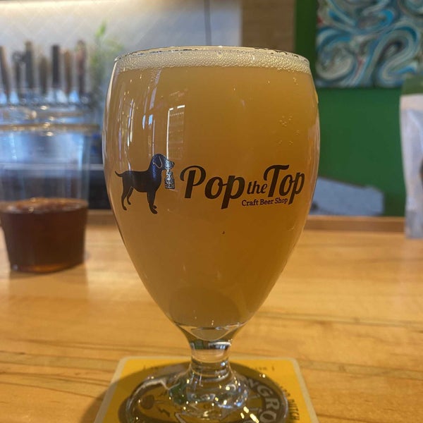 Photo taken at Pop the Top Craft Beer Shop by Christian R. on 11/29/2021
