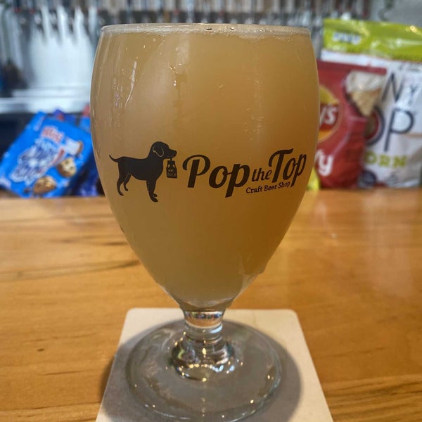 Photo taken at Pop the Top Craft Beer Shop by Christian R. on 12/31/2021