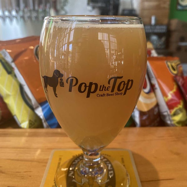 Photo taken at Pop the Top Craft Beer Shop by Christian R. on 12/14/2021