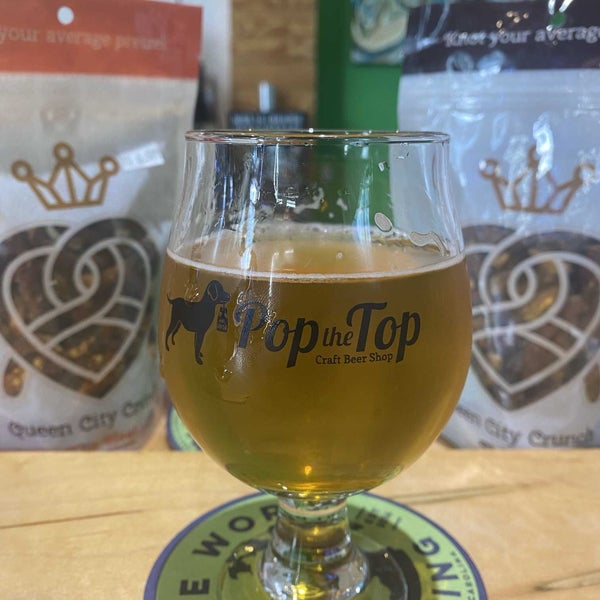 Photo taken at Pop the Top Craft Beer Shop by Christian R. on 2/16/2022