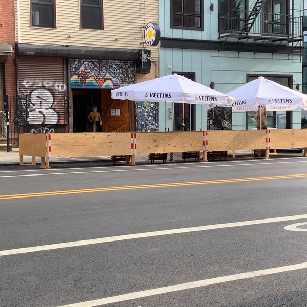 They have outdoor seating along Greenpoint Avenue.