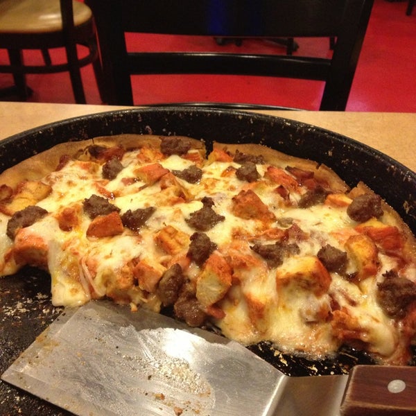 Photo taken at Classic Chicago&#39;s Gourmet Pizza by Ryan K. on 2/26/2013