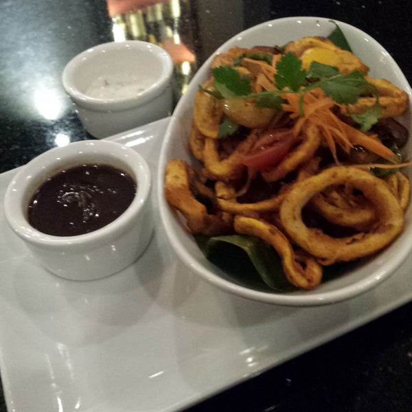 Definitely start with the black and white calamari. Very lightly breaded but still not rubbery. And the chili-tamarind ketchup is a slow burner.